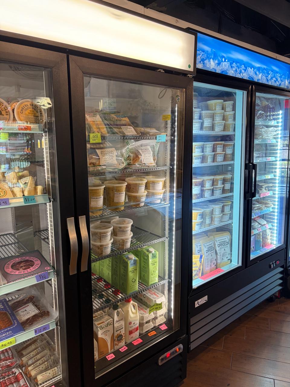 Deli case: cheeses, prepared foods, local milk